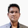 Mahesh B.