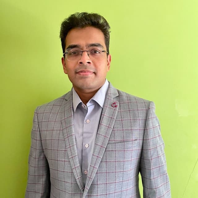 Milind B